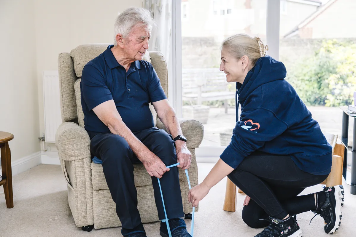 Abney & Baker care professional helping a client with personal care in Trowbridge.